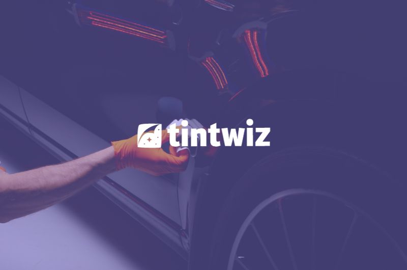 Technician using Tint Wiz CRM for efficient ceramic coating application
